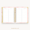 Day Designer's 2023 Weekly Planner Sunset with movie and book tracking page.
