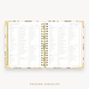 Day Designer's 2023-24 Weekly Planner Orange Blossom with packing checklist page.