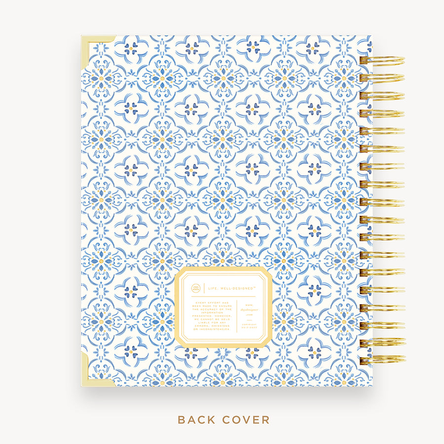 Day Designer's 2023 Daily Planner with Casa Bella back cover and gold spiral binding.