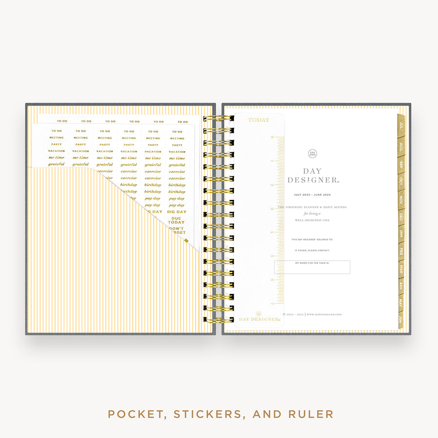 Day Designer's 2023 Daily Planner with Charcoal Bookcloth cover with pocket sleeve and gold stickers.