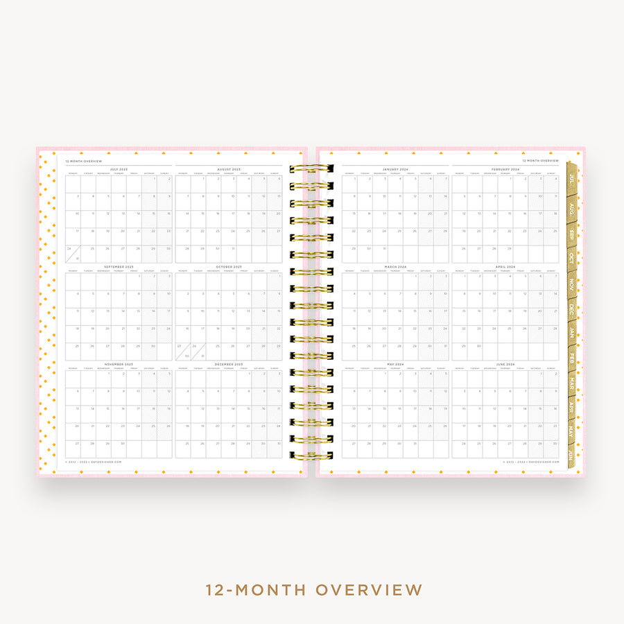 Day Designer's 2023 Daily Planner Peony Bookcloth with a two-page spread of the 2023-2024 calendar year.