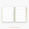 Day Designer's 2023 Daily Mini Planner Sage Bookcloth with a two-page spread of the 2023-2024 calendar year.