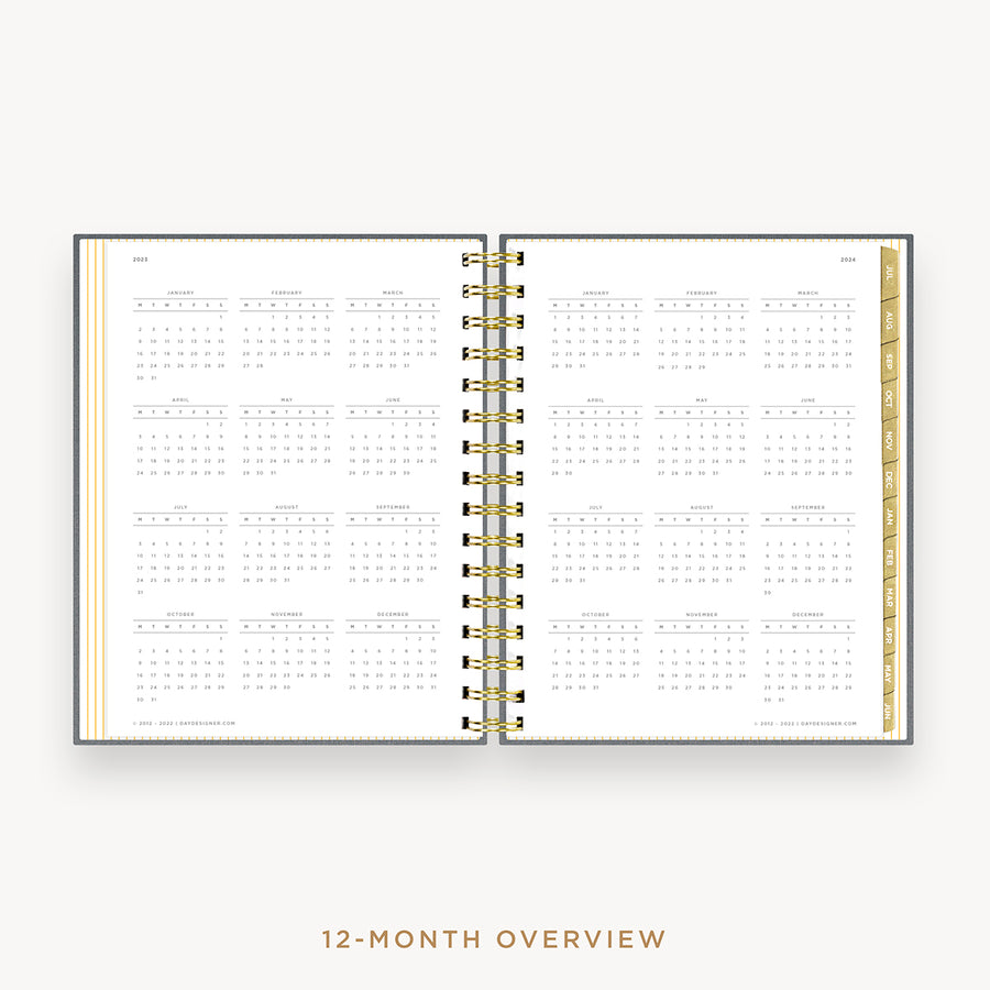 Day Designer's 2023 Daily Mini Planner Charcoal Bookcloth with a two-page spread of the 2023-2024 calendar year.