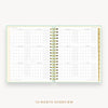 Day Designer's 2023 Daily Planner Sage Bookcloth with a two-page spread of the 2023-2024 calendar year.