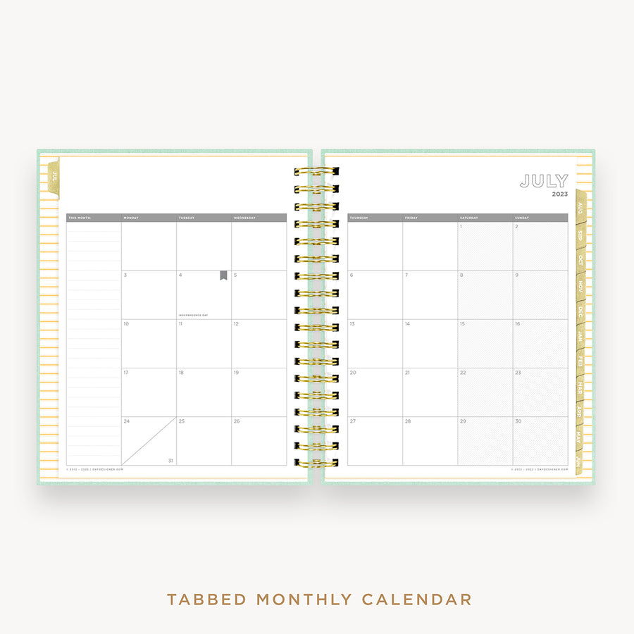 Day Designer's 2023 Daily Planner Sage Bookcloth with monthly calendar planning page.